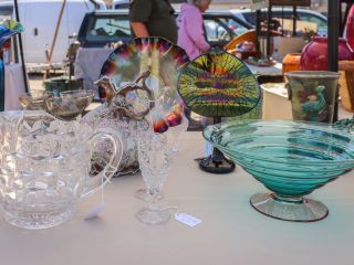 A Group Of Glass Vases On A Table